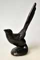 Dänischer 
Künstler (20. 
Jahrhundert): 
Ein Vogel. 
Patiniertes 
Metall. Ohne 
Signatur. H: 
12,8 cm.