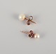 Swedish 
goldsmith. A 
pair of classic 
ear studs in 18 
...