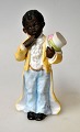 Bisquit-Figur – 
kaltbemalt, 
Deutschland des 
19. 
Jahrhunderts. 
Ein kleiner 
Junge mit 
Zylinder. H: 
...