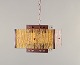 Venhola, 
Finland. 
Ceiling lamp in 
brass and 
amber-colored 
glass.
Finnish ...
