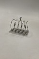 Georg Jensen 
Sterling Silver 
Bernadotte 
Toast Rack No. 
824
Measures 
10,7cm x 6,3cm, 
9,2cm / 4 ...