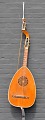 Wooden lute, 
19/20. C. To 10 
strings. With 
marquetry, 
cutouts and 
tuning screws 
in legs. Red 
...