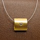 Necklace with a 
14k gold 
pendant set 
with diamond