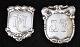 Ein Paar 
Mantelschilder 
aus Silber, 
Dänemark des 
20. 
Jahrhunderts. 
H: 5,3 - 6 cm. 
B: 3 - 5 cm. 
...