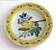 Kellinghusen-Teller, Fayence. Tiefer Teller mit Vogelmotiv. Durchmesser 23 cm. 
Mit Reparatur.