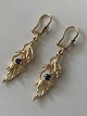 Gold earrings 
in 14 carat 
gold, with 
purple stones 
and ...