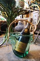 Old wine / 
champagne 
cooler in 
transparent 
green glass 
with braided 
bamboo handle 
from the 70s. 
...