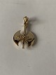 Pendant in 14 
carat gold, 
shaped like a 
double axe.
