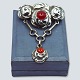 Bernhard Hertz; 
An Art Nouveau 
silver brooch 
set with ...