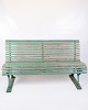 Antique French park benches from the 1930s, painted in a beautiful greenish color with a natural ...