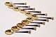 Set of 11 
coffee spoons 
in gold-plated 
sterling silver 
and blue enamel 
decorated with 
a royal ...