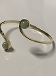Flexible bangle 
in 14 carat 
gold with 
aventurines
