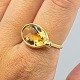 Georg Jensen; A 
Savannah ring 
of 18k gold 
with a citrine