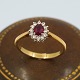 Ring in 18k gold set with a ruby and diamonds