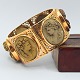 A wide Grand 
Tour bracelet 
of 14k gold set 
with classic 
faces made of 
lava. Mid 19th 
century. ...