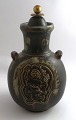 Königliches 
Kopenhagen. 
Steingut. Vase. 
Modell 2938 mit 
Bronzedeckel. 
Bode Willumsen. 
Höhe 25 ...