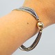 Ole Lynggaard; 
Bracelet of 
gold and silver 
with 'The ...