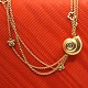 Ole Lynggaard; 
A diamond snail 
clasp of 18k 
gold, chain ...