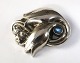 Georg Jensen. 
Brosche aus 
Sterlingsilber 
mit grünem 
Stein. Modell 
100A. Breite 35 
mm.