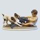 Dahl Jensen; 
Porcelain 
figurine of a 
boy and a dog. 
No. 1072. L. 
33 cm. H. 18 
cm. First.