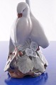 Royal 
Copenhagen 
Porzellanfigur, 
Vogelpaar nr. 
056. Höhe 10 
cm. Tadelloser 
Zustand, 2. 
Wahl. ...
