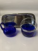 Sugar bowl and 
cream jug in 
blue glass and 
silver stain. 
...