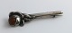 Carl V. Larsen, 
Frederiksberg 
(C.V.L.). 
Silberne 
Anstecknadel / 
Brosche mit 
Bernstein 
(830). ...