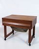 Sewing table in 
teak with 
drawer and 
wheels, made in 
classic Danish 
design from the 
1960s. The ...