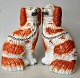 Paar 
Staffordshire-
Hunde, 19. 
Jahrhundert. 
England. 
Handbemaltes 
Fayence mit 
Vergoldung. 
Höhe: ...