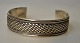 Sterling-
Armband, 20. 
Jahrhundert 
Gestempelt 925. 
Flechtmuster. 
Durchmesser: 
6,5 cm.