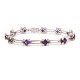 18kt Weissgold 
Armband mit 11 
Amethysten 
flankiert von 
44 Diamanten 
von ca. 0,03ct 
je
L: 18,5cm