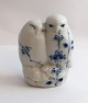 Königliches 
Kopenhagen. 
Porzellanfigur. 
Eulenpaar 
musselmalet 
gerippt. Modell 
077. Höhe 8,5 
cm. ...