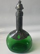 Green carafe 
with tin 
mounting and 
stopper, art 
deco, 1920s. 
Denmark.
There are 
engraved ...