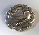Georg Jensen. 
Brosche aus 
Sterlingsilber. 
Modell 165. 
Durchmesser 4 
cm.