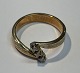 Rotgoldring mit 
3 Diamanten im 
Brillantschliff, 
20. 
Jahrhundert. 
Hugo Grün. 
Dänemark. 
Größe: ...
