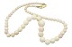 White coral 
necklace with 
14 carat gold 
lock.
Hallmarked 
"585".
Length 45.0 
...