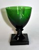 Weinglas „Gorm 
der Alte“, 19. 
Jahrhundert. 
Ganzes grünes 
Glas. 
Quadratischer 
gepresster Fuß 
mit ...