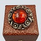 N. E. From 
silver 
jewellery.
Niels Erik 
From; A brooch 
made of 
sterling silver 
set with amber, 
...