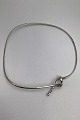 Georg Jensen 
Sterling Silver 
Neck Ring No. 
241  Forget Me 
Knot Torun
Measures 
Inside 13.5 cm 
x ...