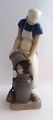 Bing & Gröndahl. Porzellanfigur. Mädchen mit Milchjunge. Modell 2181. Höhe 21,5 
cm. (1 Wahl).