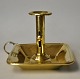Kammerleuchter 
aus Messing, 
19. 
Jahrhundert. 
Mit Griff und 
Tropfschale. H: 
12 cm. L: 16 
cm. B: ...