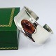 N. E. From; 
Bangle of 
sterling silver 
with amber