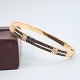 Bangle of 18k 
gold set with 
sapphires and 
diamonds