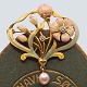 An Art Nouveau 
brooch in 18k 
gold with 
enamel, 
diamonds ...