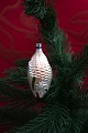 Old Christmas 
tree ornament 
in the shape of 
a small ...