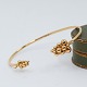 Georg Jensen; A 
Moonlight 
Grapes bangle 
in 18k gold, 
set ...