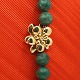 Ole Lynggaard, Charlotte Lynggaard; Clasp of 18k gold, ...