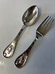 Silver plated children's spoon and fork, motif. Girl ...