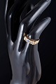 14 carat gold ring with blue and colourless stones.