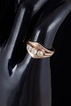 14 carat gold ring with three colourless stones.